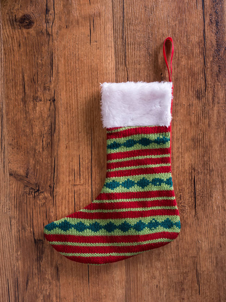 Christmas sock with on wooden background - Фото, зображення
