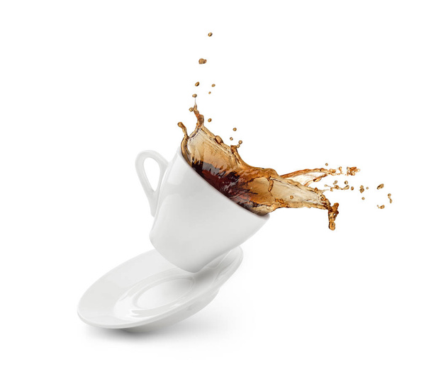 Coffee splash from a cup with plate isolated - 写真・画像