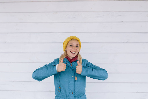 woman in yellow knitted hat  thumbs up - Photo, Image