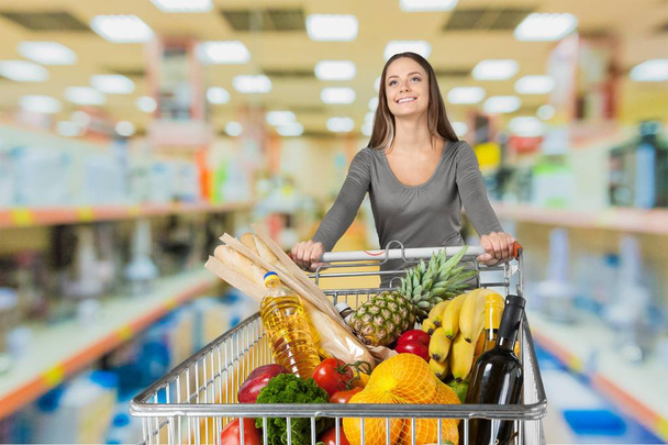 Woman with cart shopping - Foto, immagini
