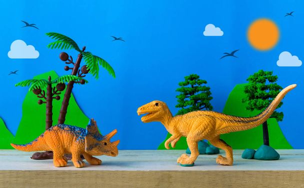 Scène de combat de dinosaures sur fond de modèles sauvages
 - Photo, image