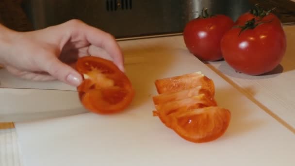 Woman cuts tomato - Felvétel, videó