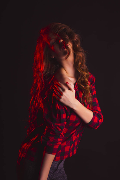 Sensual model with shadow on her face and long hair - Φωτογραφία, εικόνα