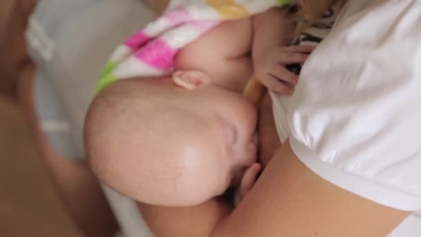 mom breastfeeding her little daughter - Footage, Video