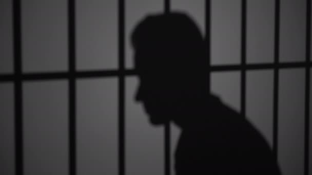 silhouette of man in prison
 - Кадры, видео