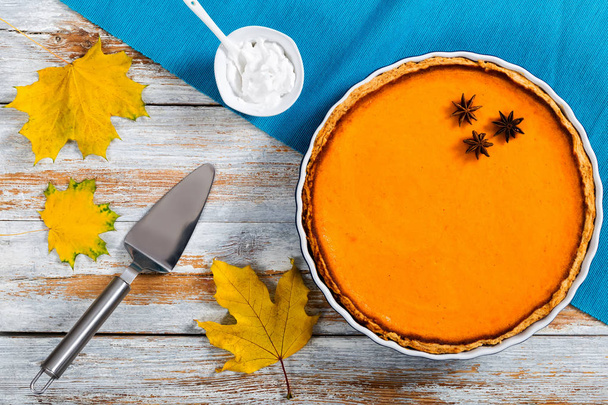delicious bright orange homemade pumpkin open pie in baking dish - Фото, изображение