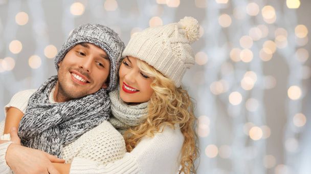 happy family couple in winter clothes hugging - Foto, imagen