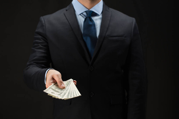 close up of businessman hands holding money - Foto, Imagem