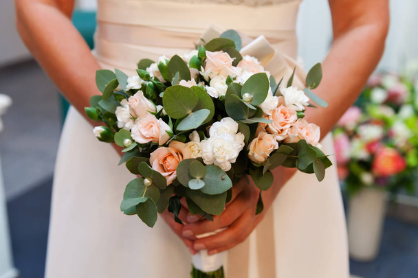 Bride with wedding bouquet in her hands - Photo, image