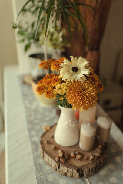 autumn still life flowers and candles - Photo, image