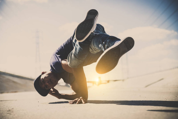 B-boy breakdancing outdoors - 写真・画像