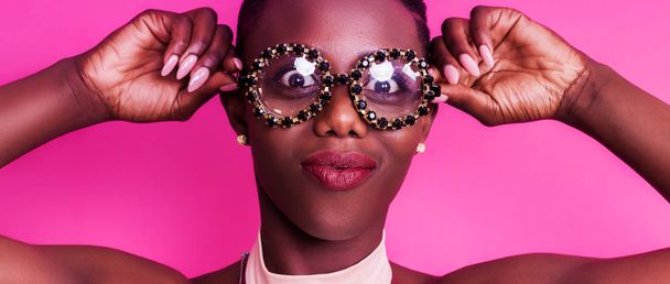 African girl making funny face while wearing odd glasses letterbox - Foto, Imagen