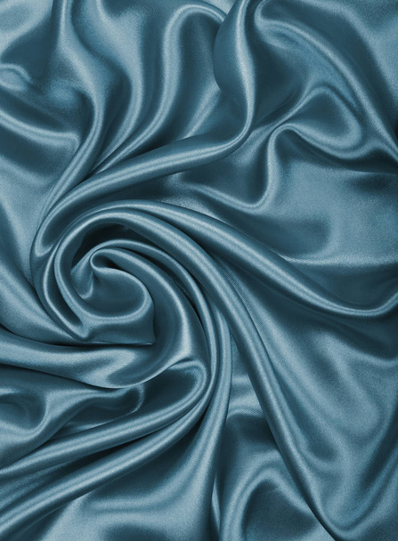 Smooth elegant dark grey silk or satin texture as abstract backg - Фото, изображение