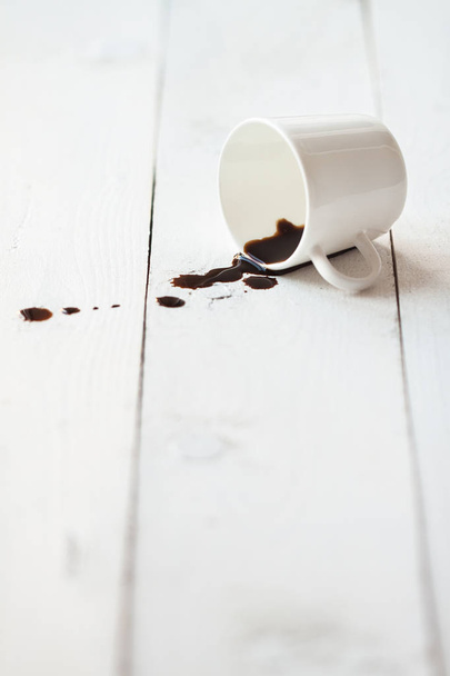 Coffee spilled on white table - Photo, Image