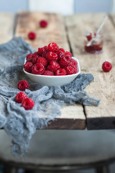 Red sweet raspberries in bowl  - Photo, Image