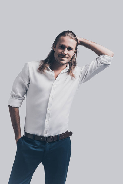 Stylish and handsome man with long hair - Фото, изображение