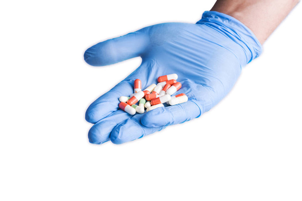 Tablets and surgical glove - Фото, зображення