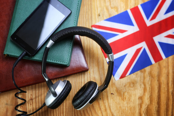 headphones and flag on a wooden background - Foto, immagini