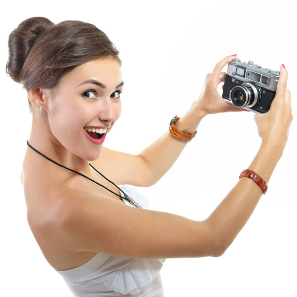 Beautiful woman holding retro camera - Photo, image