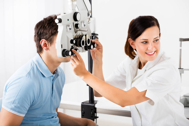 Optometrist Examining Patient's Vision  - Fotoğraf, Görsel
