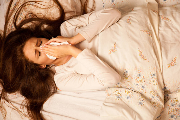 illness flu - Young Woman Lying On Bed Infected With Allergy Blo - Fotó, kép