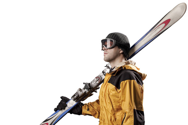スキーヤーのスキーのペアを保持しています。 - 写真・画像