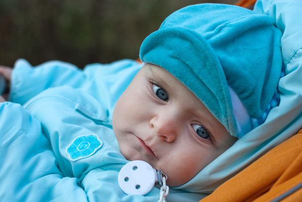 Dorable baby boy in blue clothes and with blue eyes - Photo, Image