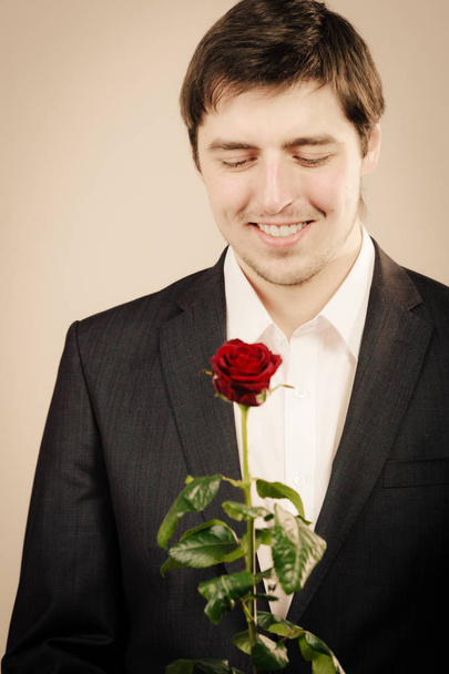 Handsome man with rose - Fotoğraf, Görsel