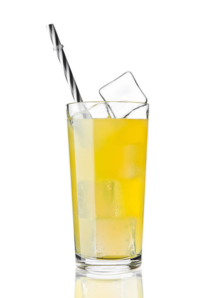 Glass of orange soda drink cold with ice cubes - Foto, afbeelding