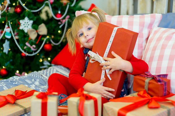 happy child girl with Christmas gifts - Photo, Image