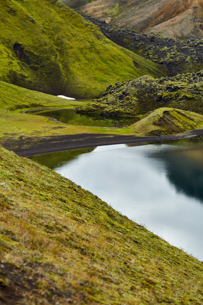 Lake coast with mountain reflection, Iceland - Foto, Bild