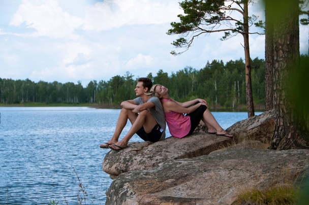 young couple at the lake shore - Fotoğraf, Görsel