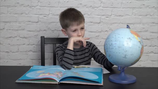 Little boy learning geography - Footage, Video