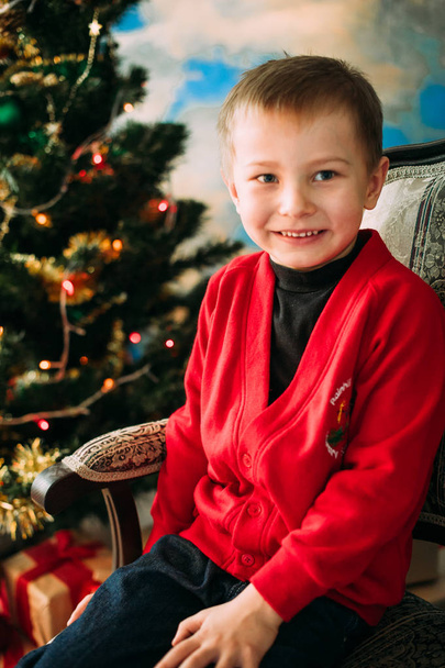 Portrait of adorable boy with giftboxes - Fotó, kép