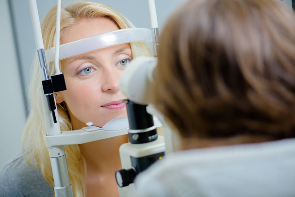 Having an eye exam - Photo, image