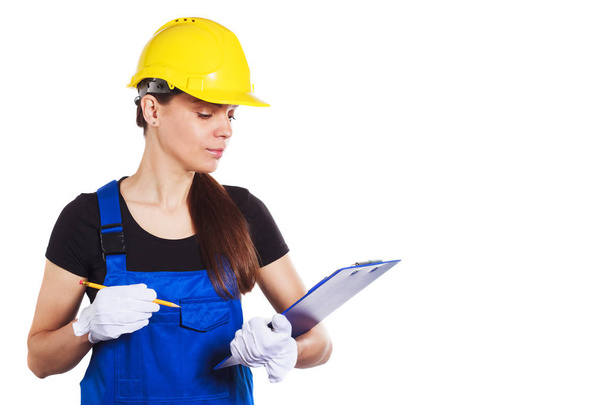 Женщина-строитель в форме с планшетом
 - Фото, изображение