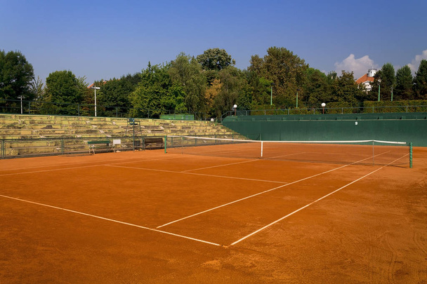      Empty red clay tennis court  - Photo, image