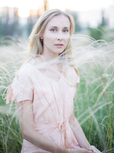 portrait of a girl in feather grass - 写真・画像