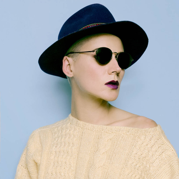 Glamorous model in the Hat Country style and vintage glasses - 写真・画像