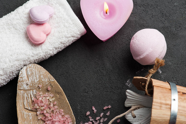 bath bomb closeup with pink lit candle - Foto, Imagem
