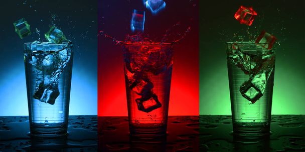 Beautiful splash cocktail with ice. Checkered faceted glass with a cocktail. - 写真・画像
