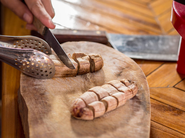 baked banana, on Wooden table . Knives and cutting boards. - Photo, Image