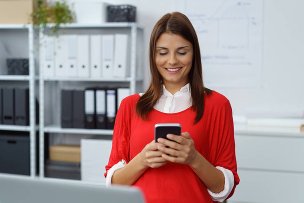 Successful businesswoman reading a text message - Photo, Image
