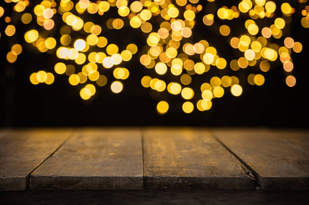 Blurred abstract golden spot lights with wood - Fotografie, Obrázek