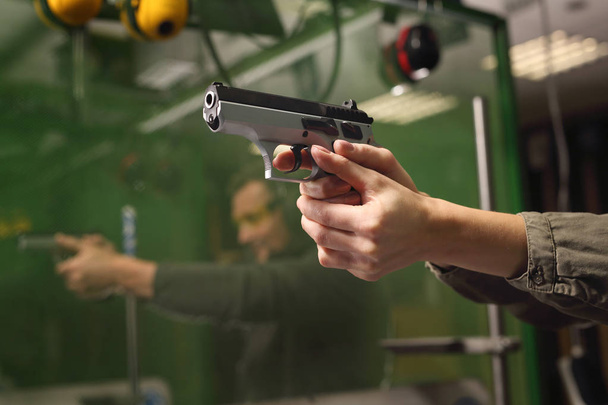 Self-defense, the woman at the shooting range - Valokuva, kuva