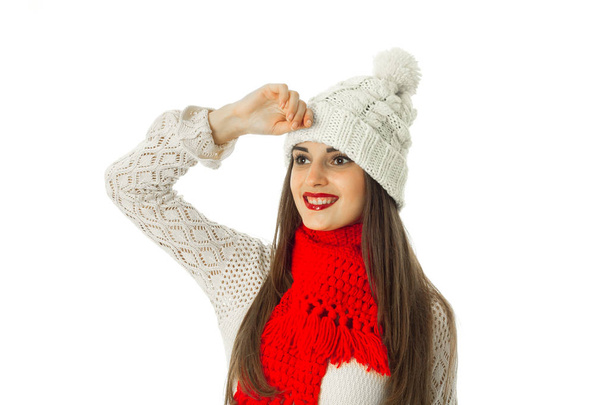 brunette girl in warm sweater and red scarf  - Φωτογραφία, εικόνα