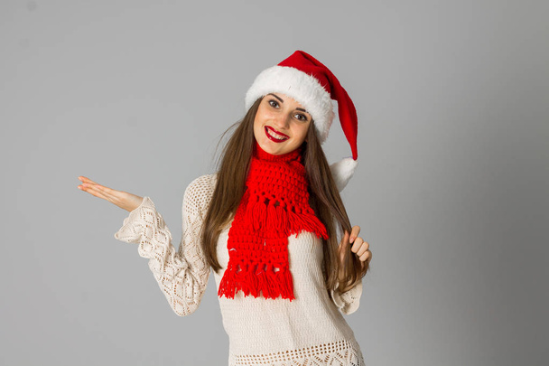 girl in santa hat and red scarf - Zdjęcie, obraz