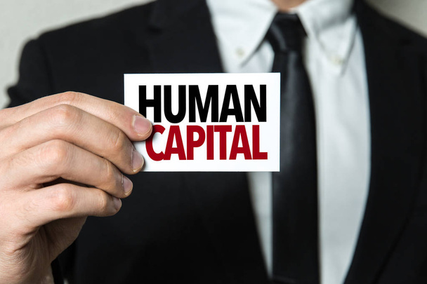 tarjeta con signo de capital humano
 - Foto, Imagen