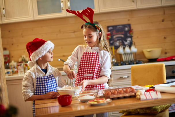 children preparing Christmas cookies - 写真・画像
