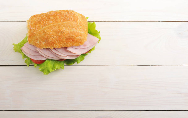sandwich with ham, tomato and lettuce - Фото, зображення